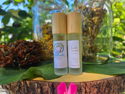 Earth Serum Anti-Aging Under Eye Serum Roller by Stillwater Naturals — botanical facial oil in roller bottle for glowing skin
